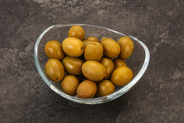 Green pickled olives in the bowl