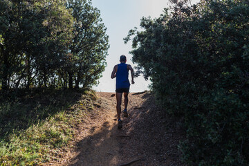 Determined man running on nature during workout