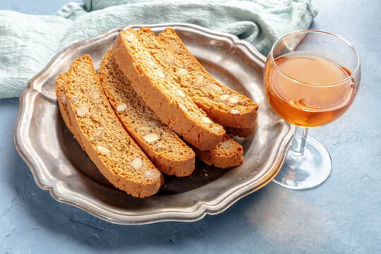Biscotti, traditional Italian almond biscuits, with a glass of vin santo sweet wine