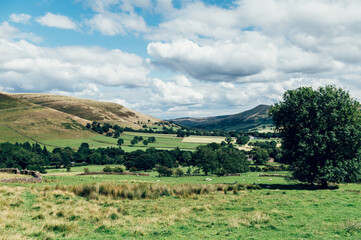 Naklejka premium Beautiful field view on Edale village and Mam Tor at Peak District National Park, England, UK. Staycation concept of traveling local