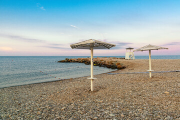 Beach umbrellas on the beach in the city of Nebug, Russia...