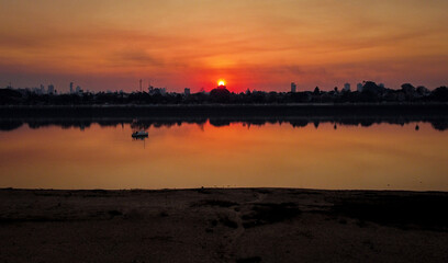 sunset over river laguna santa fe argentina