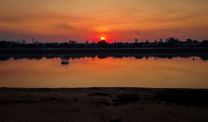 Fototapeta premium sunset over river laguna santa fe argentina