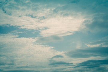 Stratus clouds. White clouds floating on the blue sky in the summer. Background