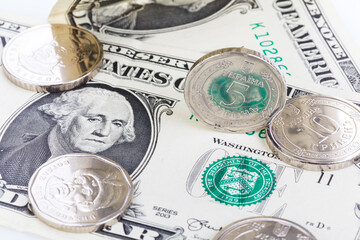 Ukrainian hryvnia next to the dollar on a white background, isolate. The concept of the...