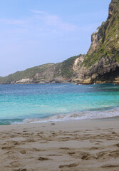 Manta Bay or Kelingking Beach on Nusa Penida Island, Bali, Indonesia. Amazing  view, white sand beach with rocky mountains and azure lagoon with clear water of Indian Ocean 