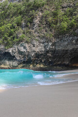 Manta Bay or Kelingking Beach on Nusa Penida Island, Bali, Indonesia. Amazing  view, white sand beach with rocky mountains and azure lagoon with clear water of Indian Ocean 