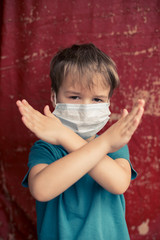 Portrait of Toddler kid wearing medical mask.A boy wearing mouth mask against air smog pollution. Concept of coronavirus quarantine or covid-19.Protection against virus and infection control concept