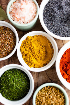 Bowls of curry assorted seeds and spices