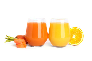 Glasses of delicious juices, fresh orange and carrot on white background