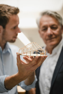 Architect presenting architectural modell to client