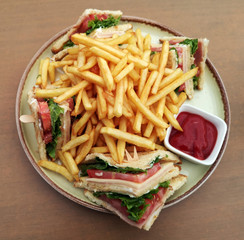 Club sandwiches and french fries