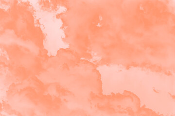 Light orange coral sky with fluffy big clouds, sky background
