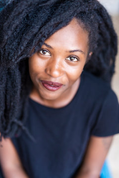 Portrait of young woman with dreadlocks