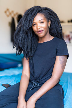Portrait of young woman with dreadlocks