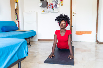 Young woman doing yoga at home