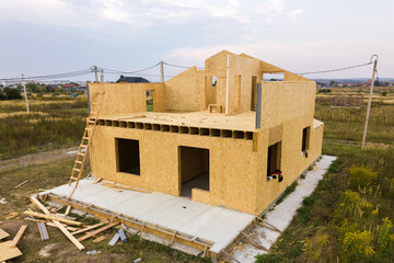 Construction of new and modern modular house. Walls made from composite wooden sip panels with...