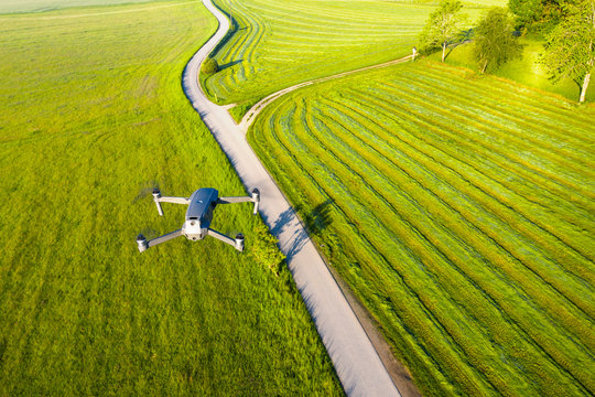 Germany, Bavaria, Icking, Drone flying over countryside dirt road