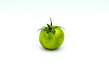 A green zebra tomato on a white background. Perfect shot for veganism, vegan and Mediterranean diet.