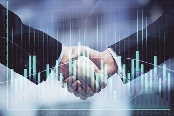 Double exposure of forex graph hologram and handshake of two men. Stock market concept.