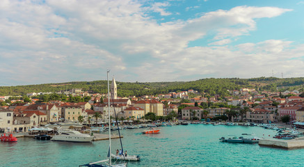 Beautiful picturesque view of the town of Supetar, as seen from the car ferry from up high. Warm summer day on the small coastal town on the island of Brac