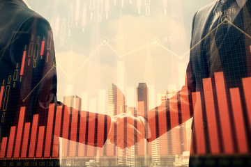 Double exposure of forex graph hologram and handshake of two men. Stock market concept.