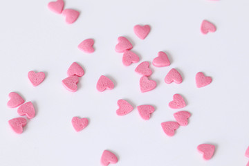 Pink sweet hearts on a white background.