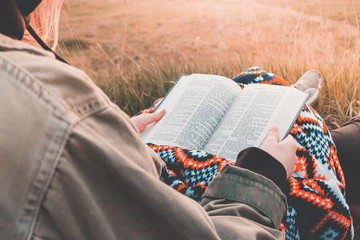 girl reads the bible 