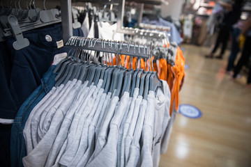 T-shirts with hangers in the store