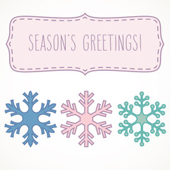 Season's greetings in a frame with snowflakes