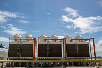 Cooling towers in data center building. Air conditioning cooling towers in front of building with...