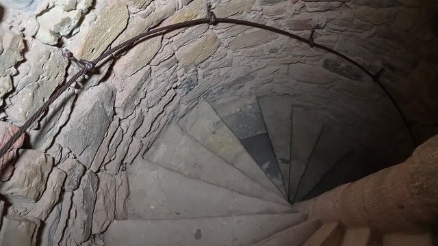 An entrance to the dungeon. An ancient stone spiral staircase.