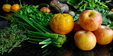 A small variety of fruits and vegetables that have just arrived from the organic fair.