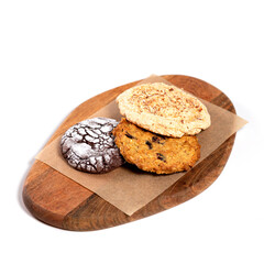 Homemade stacked sponge cake sweet cookies with sesame seeds, peanuts, sunflower background on wooden table