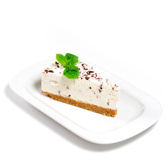 Place of cheesecake on a white plate, close-up view. White background