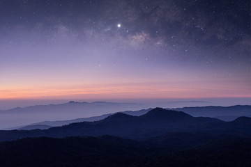Stars and Milky Way in the dark night sky on the mountains of northern Thailand.