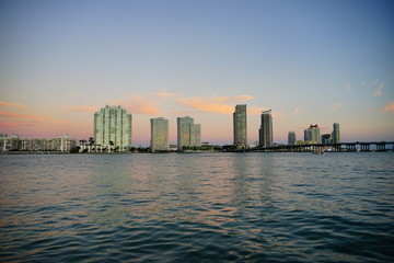 Miami downtown skyscrapers and beach at sun set	
