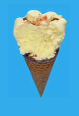 angle view vanilla flaovr ice cream cone with a big bite on a blue background
