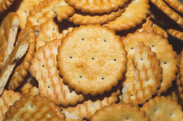 Round crackers. crispy cookies background. pile of biscuits