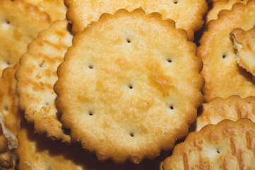 Round crackers. crispy cookies background. pile of biscuits