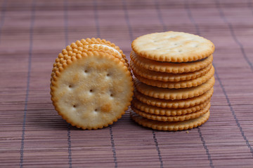 Cream sandwich biscuits on bamboo curtain background