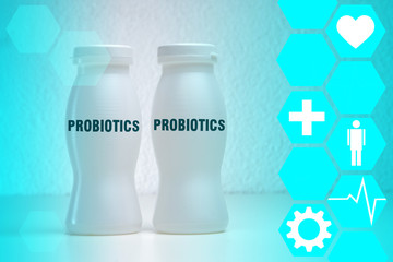 Probiotic foods yogurt. Inscription probiotics white bottles. Yogurt contains beneficial bacteria. Concept - foods with Useful Probiotics. Crayfish with yogurt on a light background. Food additives.