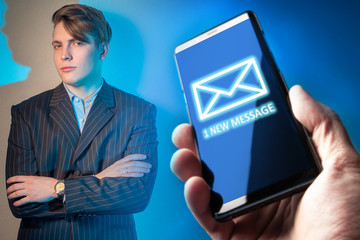 1 new message. Young man is holding out a telephone. Concept - person is shown a new message on the...