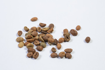 Organic green coffee beans isolated on white background close up. Top view. Flat lay
