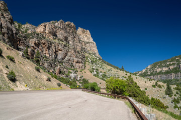 Fototapeta na wymiar The imposing, winding twisty mountain road through Tensleep Canyon, part of the Cloud Peak Skyway through the Wyoming Bighorn Mountains