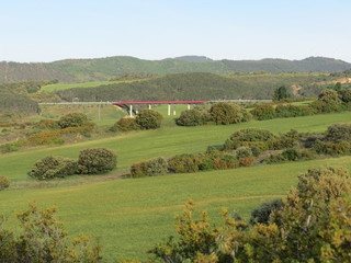 Fields and red bridge