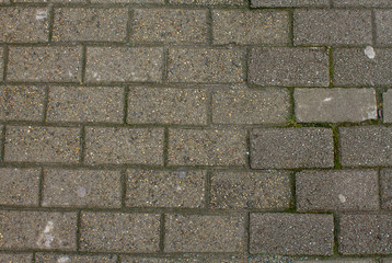 Street paving stones top view. Detailed photo of the road surface.