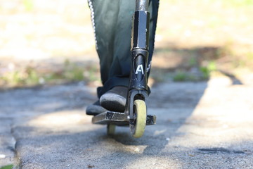 stunt scooter in action, scooter acrobatics