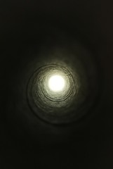 Light in the tunnel.Bright light at the end of the tunnel shows that this is the way out