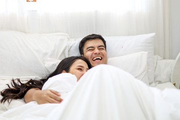 Happiness young couple lover sleeping and relaxation on bedroom.